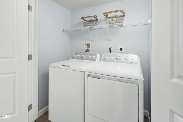 laundry area with laundry area and washer and clothes dryer