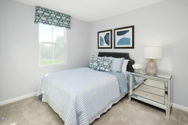 carpeted bedroom with baseboards