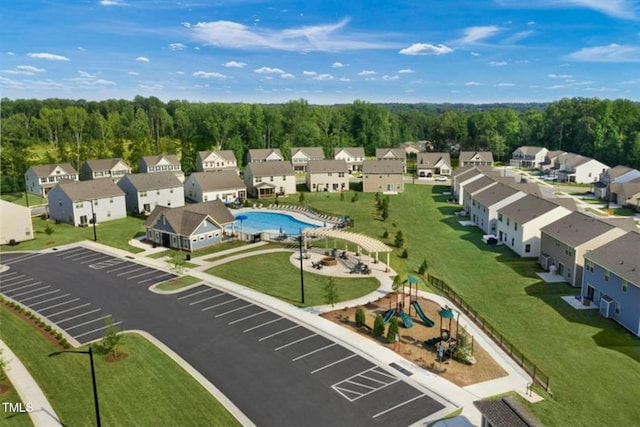 bird's eye view with a forest view and a residential view