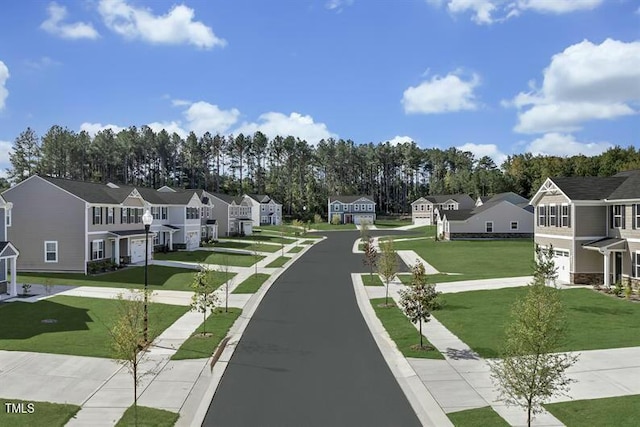 view of road featuring sidewalks, a residential view, and street lighting