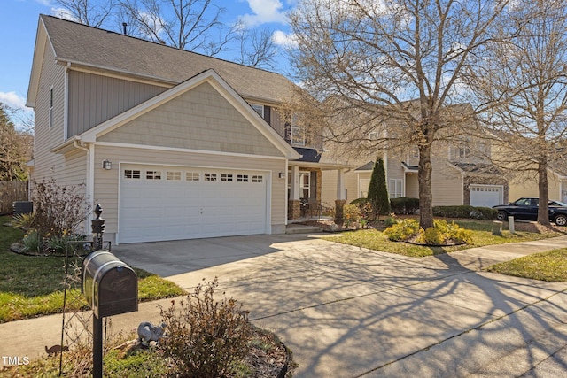 view of front of home with driveway and a garage