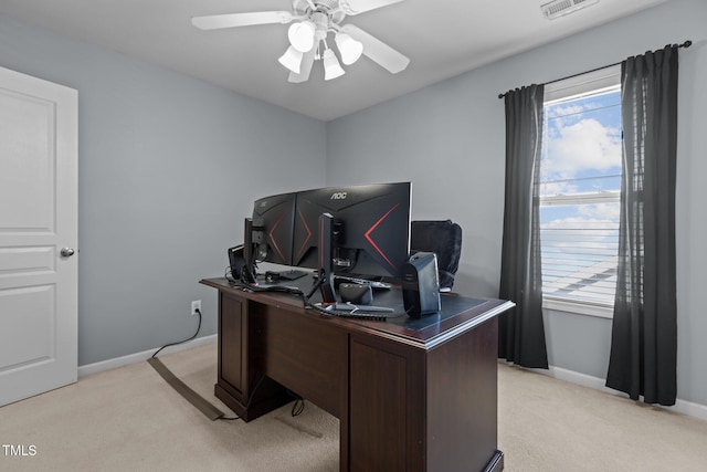 office with visible vents, light carpet, and a healthy amount of sunlight