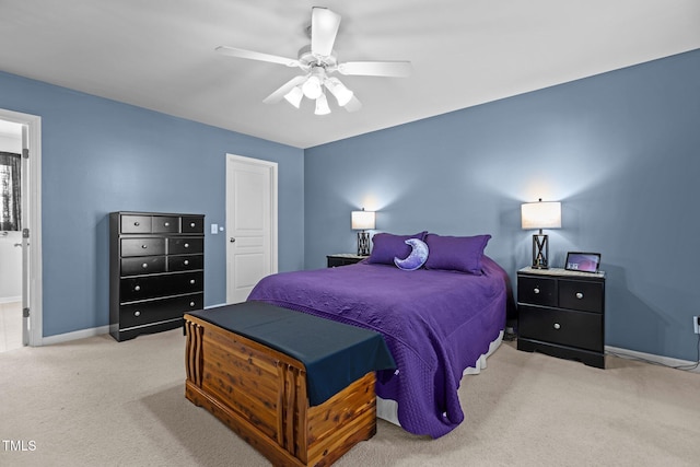 bedroom with carpet flooring, a ceiling fan, and baseboards