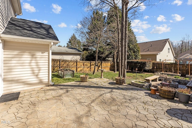 view of patio featuring fence