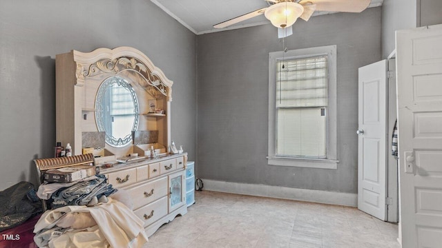 bedroom featuring crown molding, baseboards, and ceiling fan