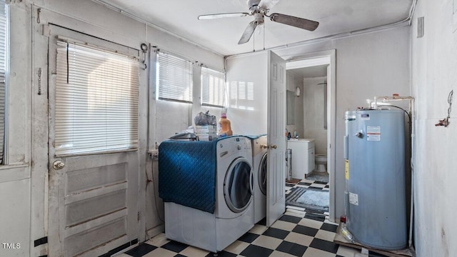 laundry area featuring ceiling fan, light floors, washing machine and dryer, and water heater