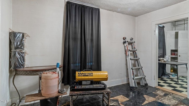 interior space featuring a textured ceiling