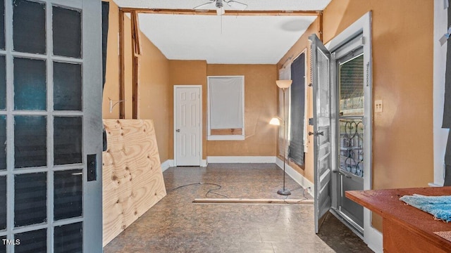 bathroom featuring baseboards and ceiling fan