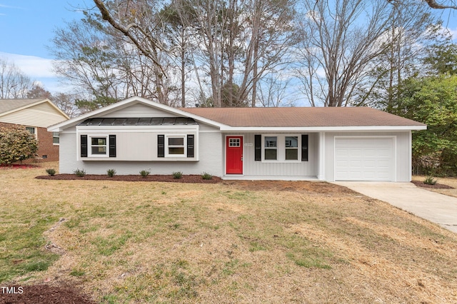 ranch-style home featuring brick siding, a front yard, concrete driveway, and an attached garage