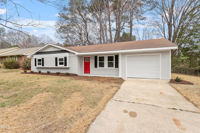 ranch-style house with a front yard, a garage, and driveway