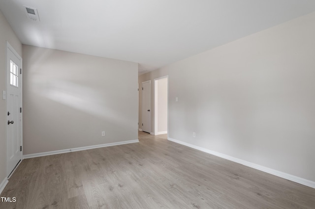 interior space featuring visible vents, baseboards, and light wood-style flooring