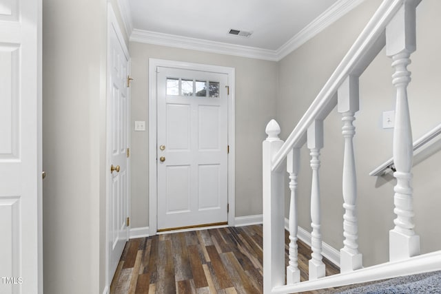 entrance foyer featuring dark wood-type flooring, baseboards, visible vents, and ornamental molding