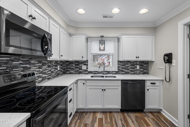 kitchen featuring stainless steel microwave, dishwashing machine, dark wood-style floors, electric range, and a sink