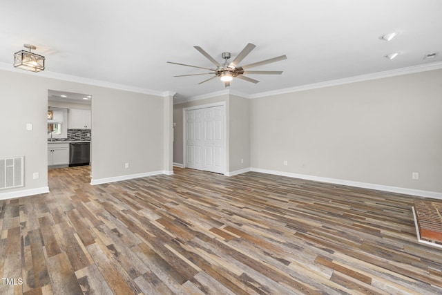 unfurnished living room with a ceiling fan, wood finished floors, visible vents, baseboards, and crown molding