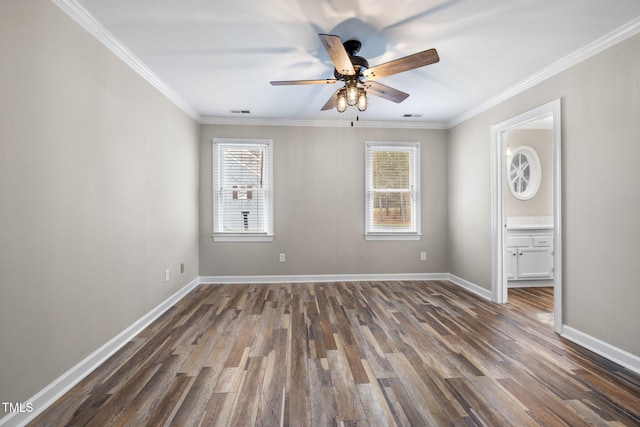 unfurnished bedroom featuring visible vents, baseboards, dark wood-style flooring, and crown molding