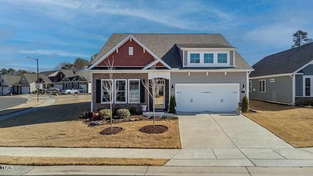 craftsman house featuring driveway and an attached garage