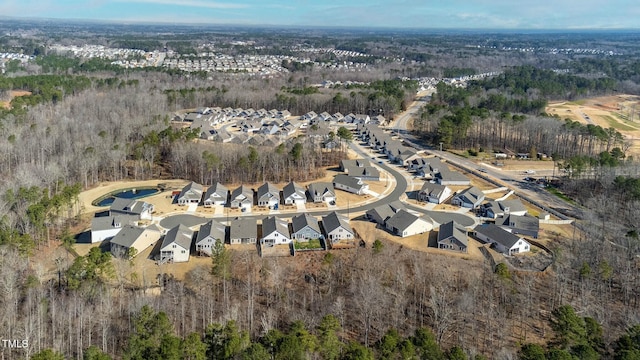 bird's eye view featuring a residential view and a view of trees