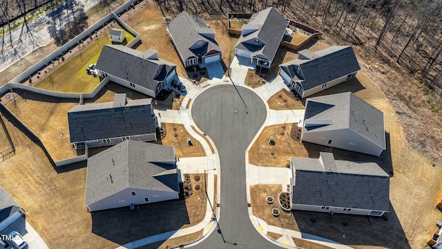 birds eye view of property with a residential view