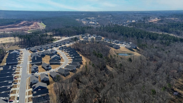 bird's eye view with a forest view