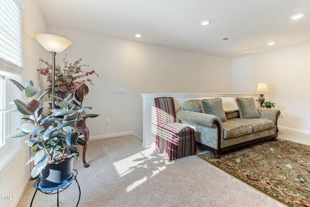 carpeted living room featuring recessed lighting, visible vents, and baseboards