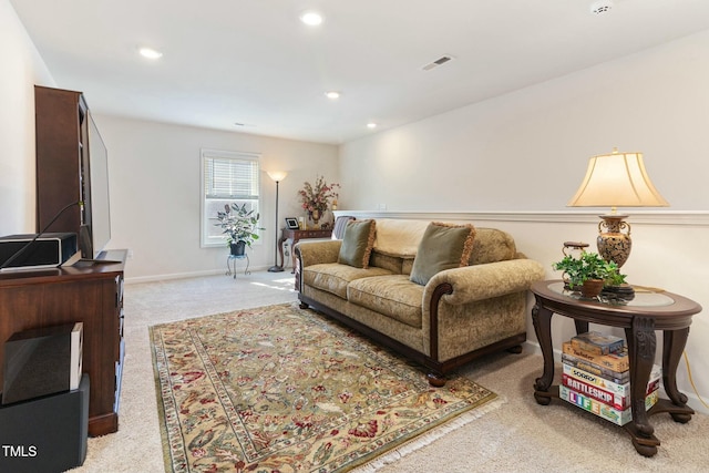 living room featuring light colored carpet, recessed lighting, visible vents, and baseboards