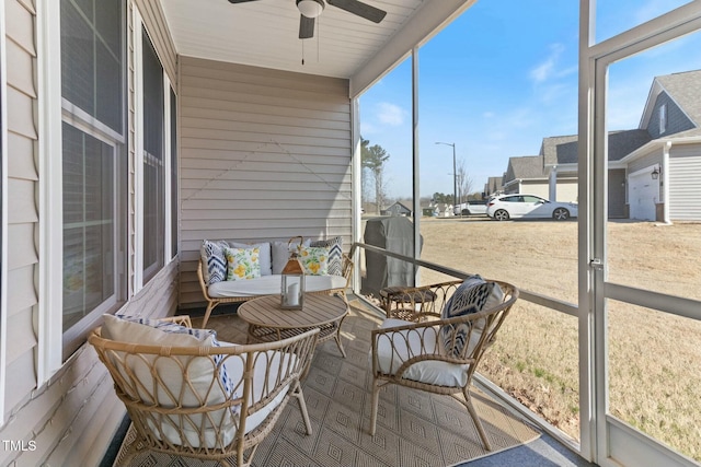 sunroom / solarium with a ceiling fan