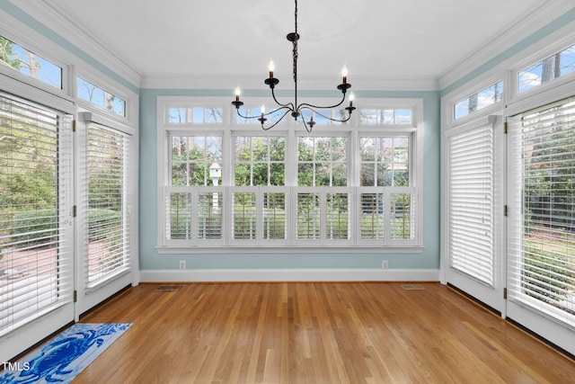 unfurnished sunroom with a chandelier