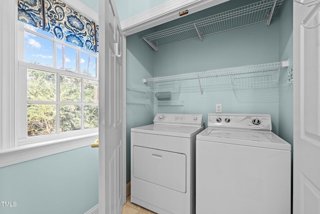 clothes washing area featuring laundry area and separate washer and dryer