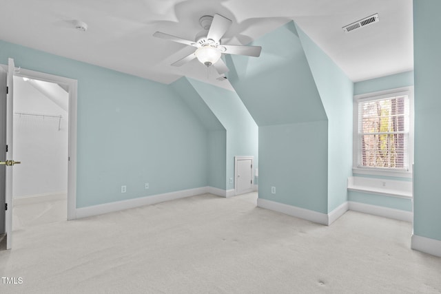 bonus room with a ceiling fan, baseboards, visible vents, carpet floors, and vaulted ceiling