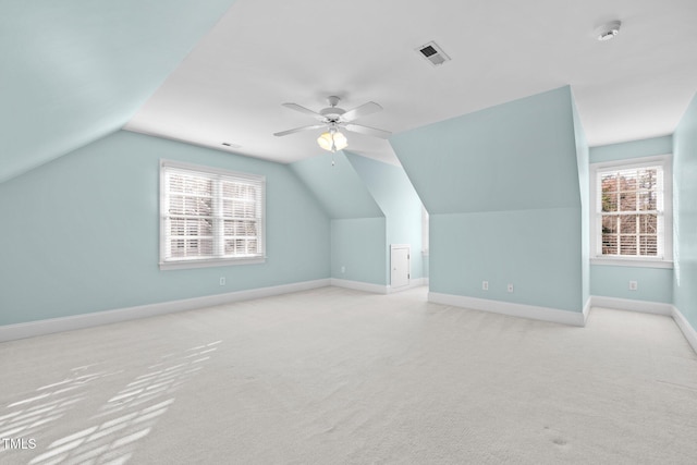 bonus room featuring visible vents, plenty of natural light, carpet floors, and baseboards