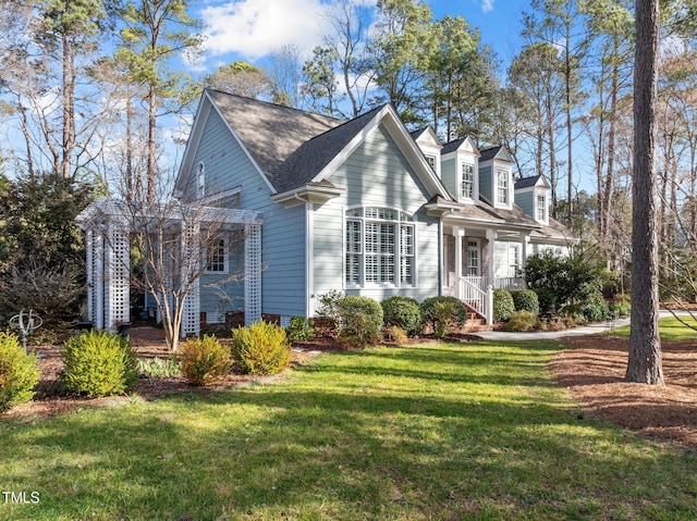 view of property exterior with a lawn and roof with shingles