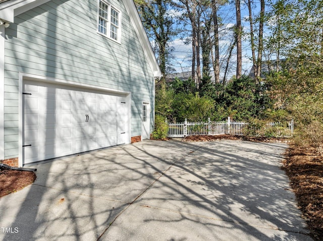 view of home's exterior with fence