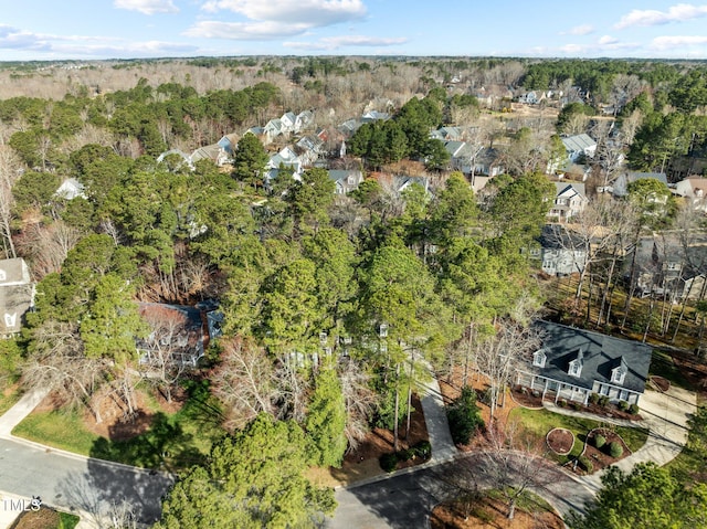 aerial view featuring a wooded view