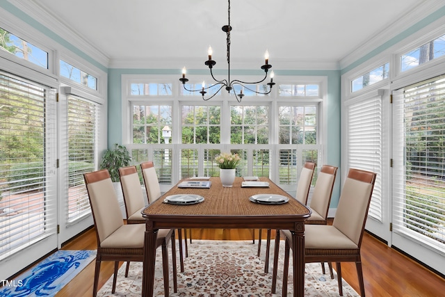 sunroom / solarium with an inviting chandelier and plenty of natural light