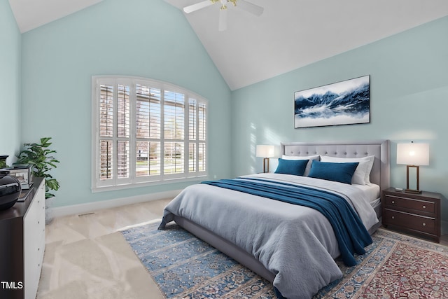 carpeted bedroom with ceiling fan, baseboards, and vaulted ceiling