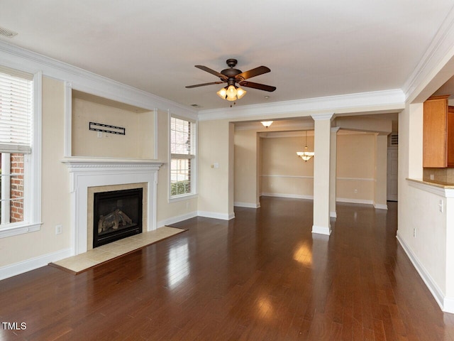 unfurnished living room featuring wood finished floors, baseboards, a fireplace with flush hearth, ceiling fan, and crown molding