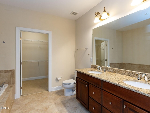 full bathroom with a sink, visible vents, toilet, and double vanity