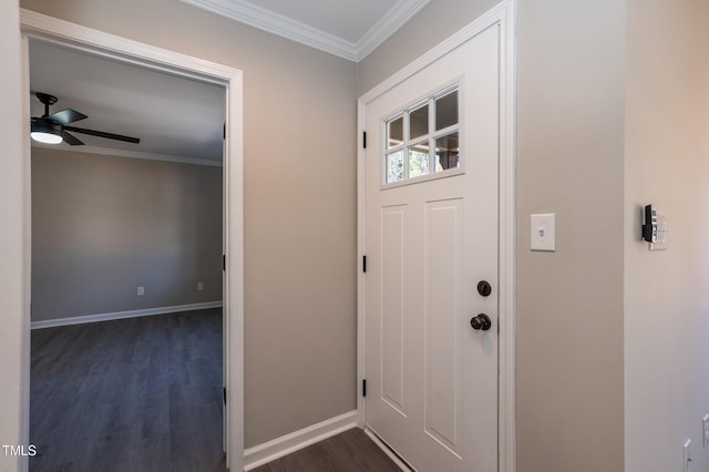 entryway with baseboards, dark wood finished floors, and crown molding