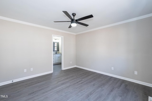 unfurnished room featuring ceiling fan, dark wood-type flooring, baseboards, and ornamental molding