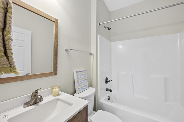 bathroom with vanity, toilet, and bathtub / shower combination