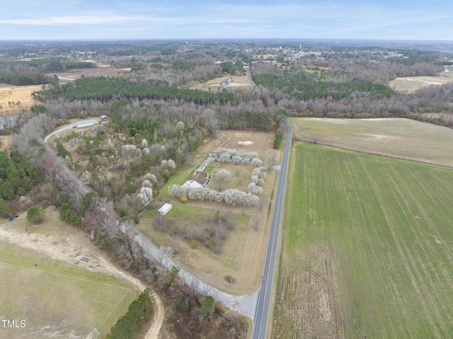 birds eye view of property with a rural view