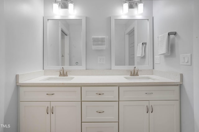 bathroom with double vanity and a sink