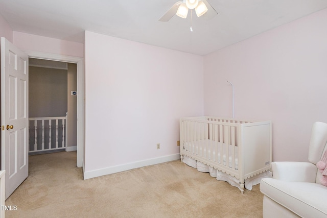 bedroom with baseboards, carpet floors, and a ceiling fan