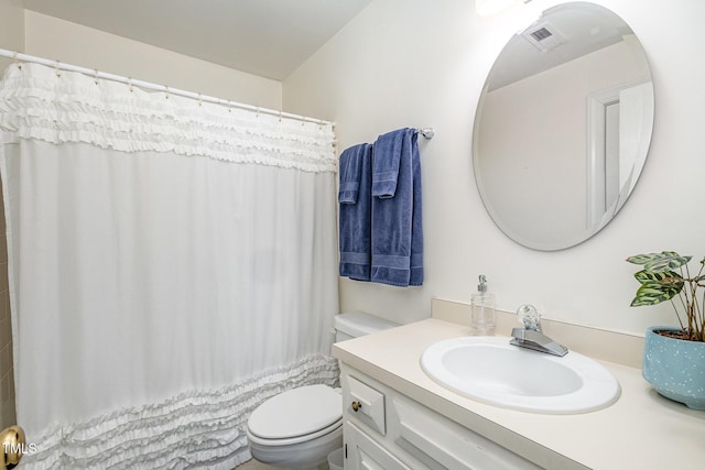 bathroom with a shower with shower curtain, toilet, and vanity