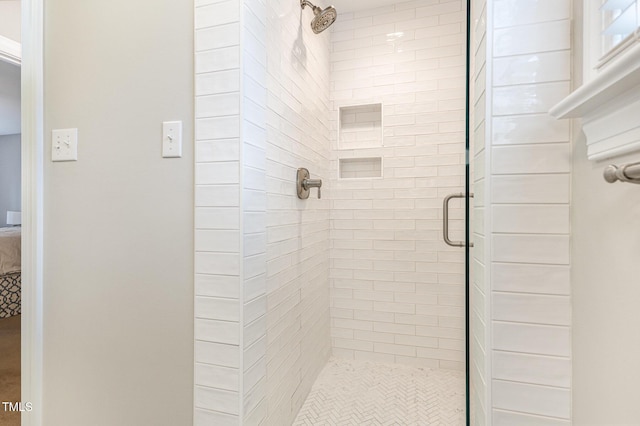 bathroom featuring a shower stall