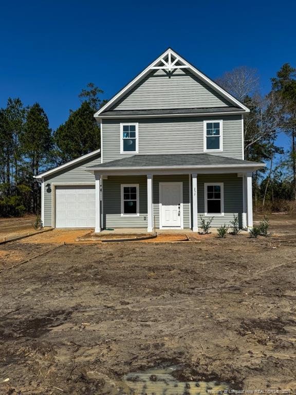 view of front of home with a porch and an attached garage