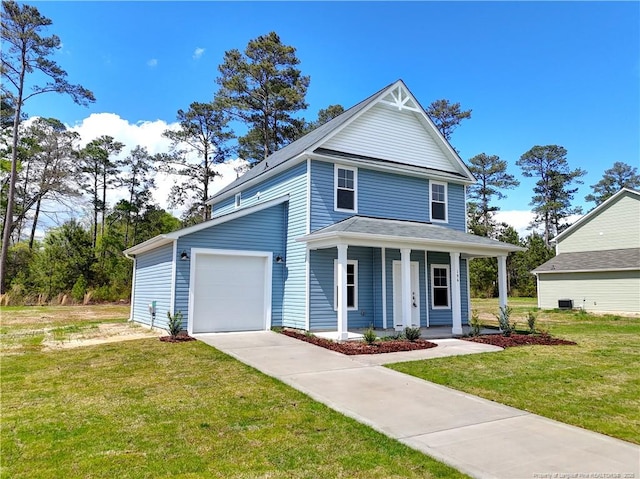 view of front facade featuring concrete driveway, a porch, and a front yard