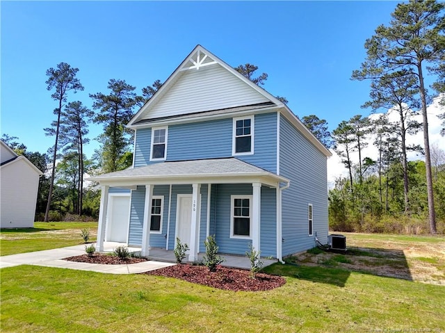 view of front of home featuring covered porch, a front lawn, and central air condition unit