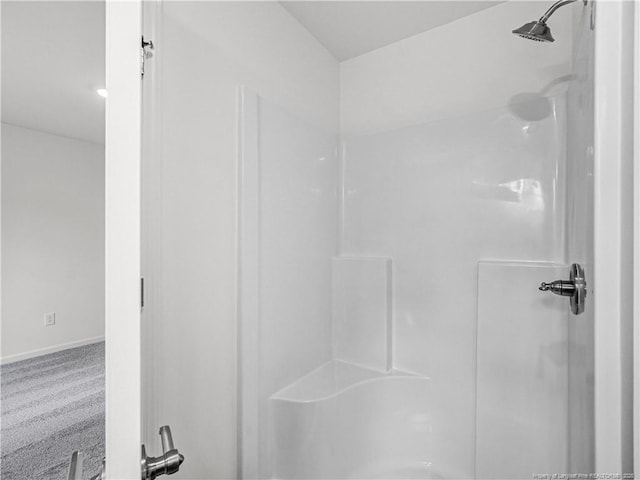 full bath featuring baseboards and a shower