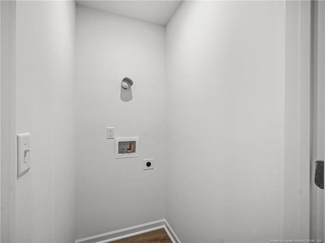 clothes washing area with hookup for an electric dryer, laundry area, dark wood finished floors, baseboards, and hookup for a washing machine